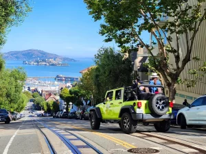 Private San Francisco Jeep tour on cable car tracks with Alcatraz in the distance