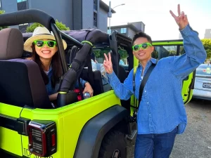 Two happy guests ready for a private San Francisco Jeep sightseeing tour