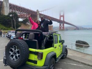 Two travelers with a private Jeep at the Golden Gate Bridge