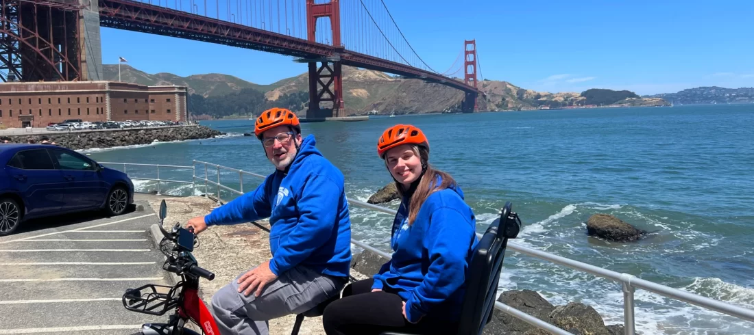 Golden Gate Bridge view Three person rickshaw E-Trike rental in San Francisco with GPS Tour onboard